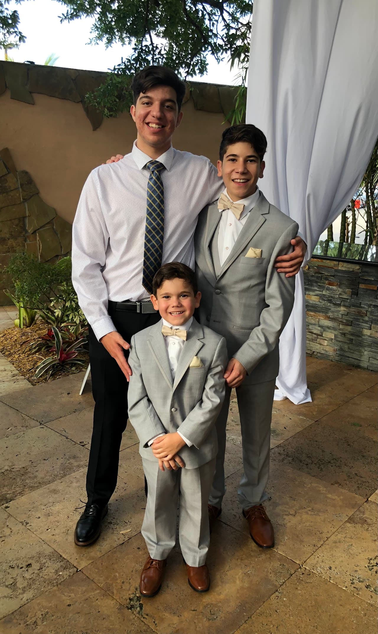Ryan with his two younger brothers at home