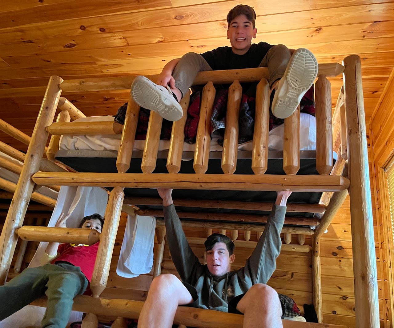 Ryan with friends in the cabin kitchen